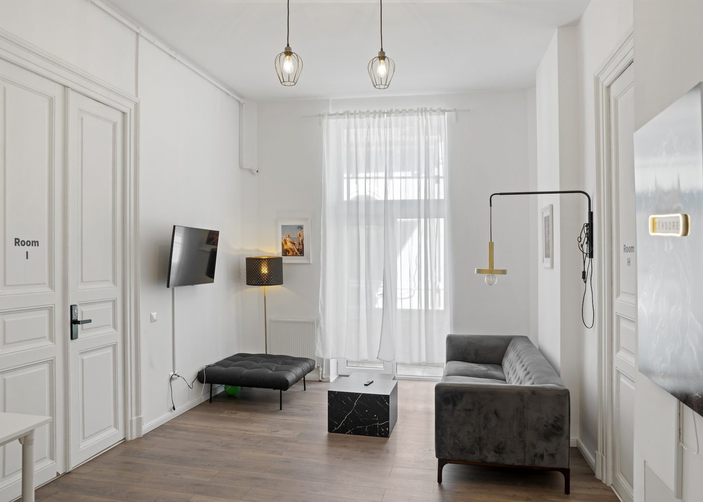 Lounge with velvet sofa and marble tables